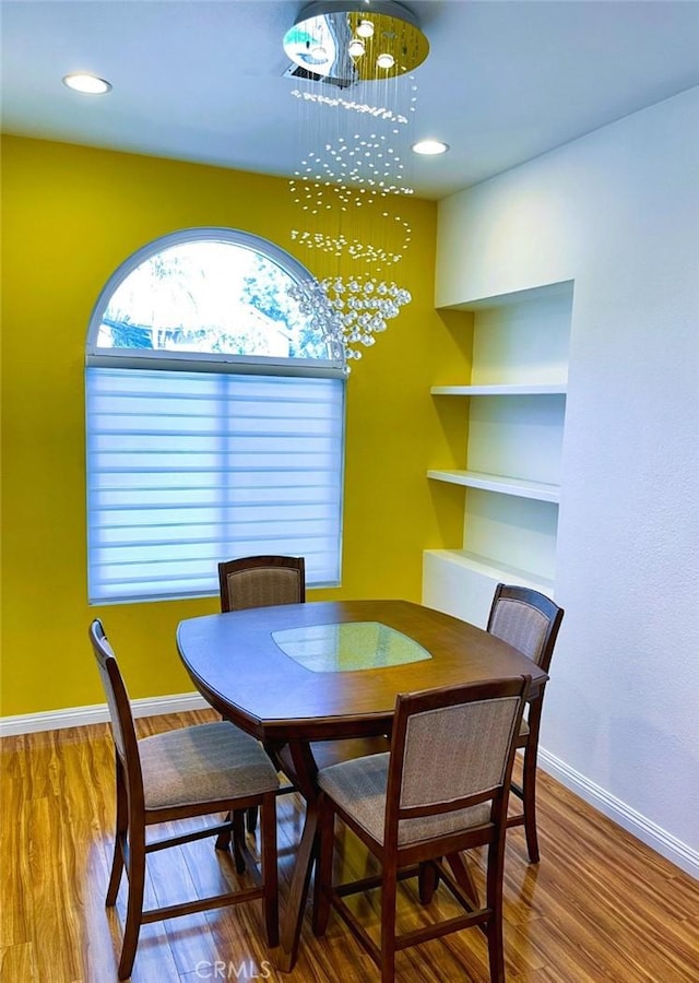 11259 Corsica Ct, Rancho Cucamonga, CA 91730 - dining area featuring a chandelier, wood finished floors, and recessed lighting