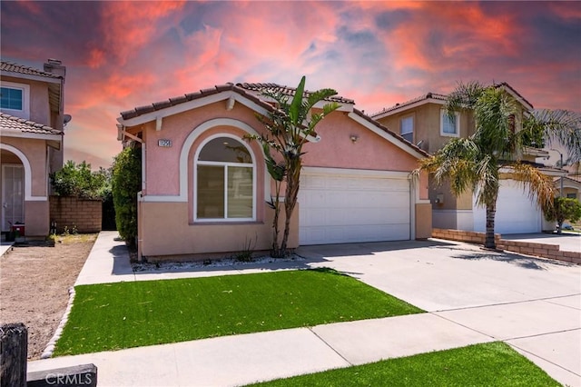 11259 Corsica Ct, Rancho Cucamonga, CA 91730 - mediterranean / spanish house with concrete driveway, a garage, stucco siding, and a tile roof