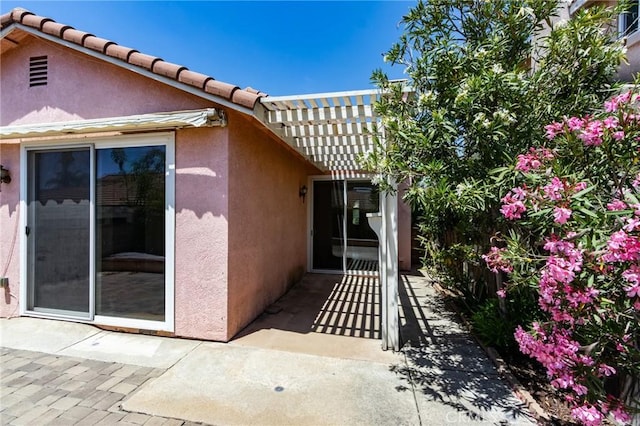 11259 Corsica Ct, Rancho Cucamonga, CA 91730 - view of side of home featuring stucco siding, a patio, a pergola, and a tiled roof