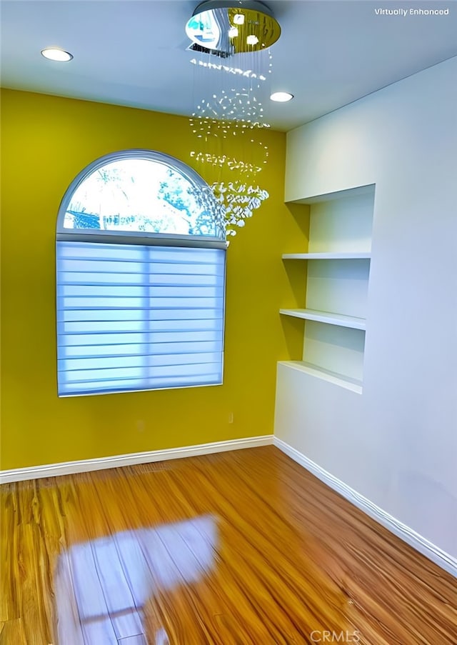 11259 Corsica Ct, Rancho Cucamonga, CA 91730 - spare room featuring a chandelier, wood finished floors, and recessed lighting