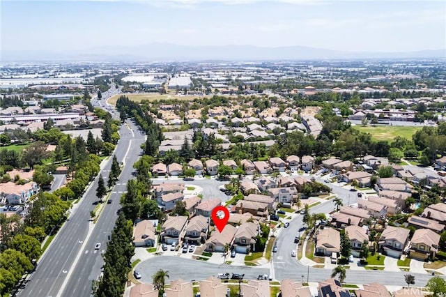 11259 Corsica Ct, Rancho Cucamonga, CA 91730 - aerial overview of property's location featuring nearby suburban area and a mountain backdrop