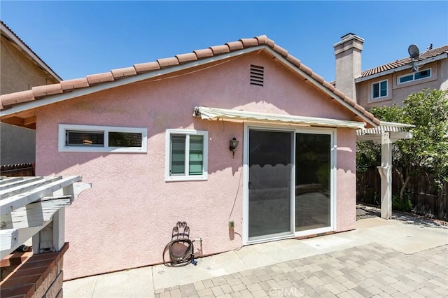 11259 Corsica Ct, Rancho Cucamonga, CA 91730 - back of house with a patio, stucco siding, a chimney, and a pergola