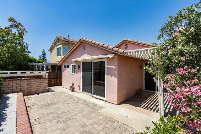 11259 Corsica Ct, Rancho Cucamonga, CA 91730 - back of property featuring stucco siding, a patio area, and a tiled roof