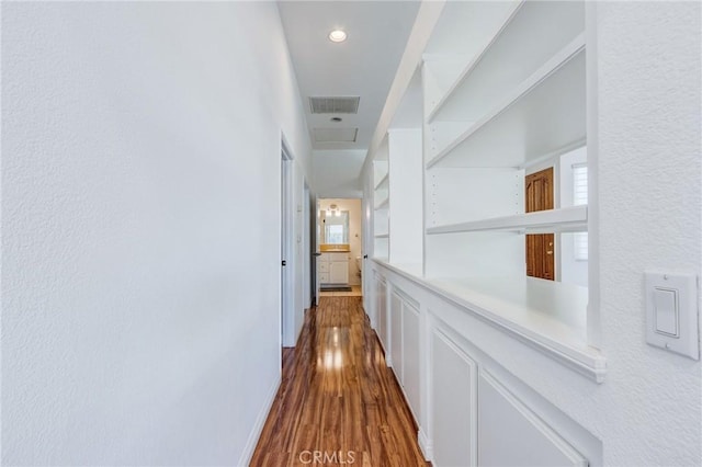 11259 Corsica Ct, Rancho Cucamonga, CA 91730 - hall with dark wood-type flooring, healthy amount of natural light, and a textured wall