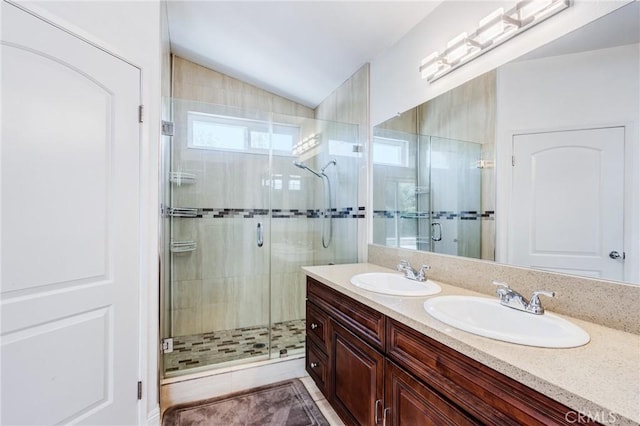 11259 Corsica Ct, Rancho Cucamonga, CA 91730 - full bathroom with a shower stall, double vanity, and vaulted ceiling