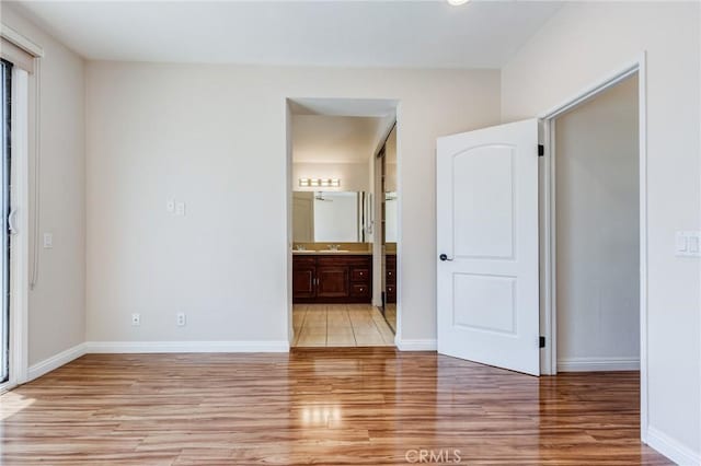 11259 Corsica Ct, Rancho Cucamonga, CA 91730 - unfurnished bedroom with light wood-style flooring and connected bathroom