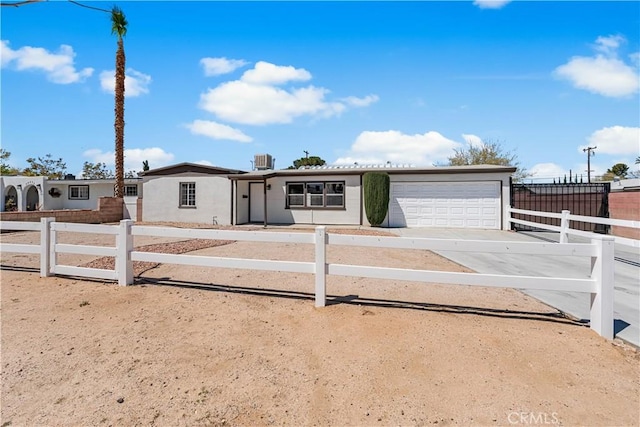 38881 Sage Tree St, Palmdale, CA 93551 - ranch-style house featuring concrete driveway, an attached garage, a fenced front yard, and central AC
