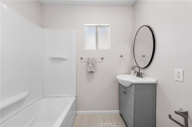 38881 Sage Tree St, Palmdale, CA 93551 - bathroom featuring vanity, baseboards, and bathing tub / shower combination