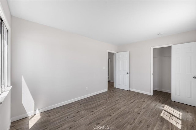 38881 Sage Tree St, Palmdale, CA 93551 - unfurnished bedroom featuring a closet, wood finished floors, and baseboards
