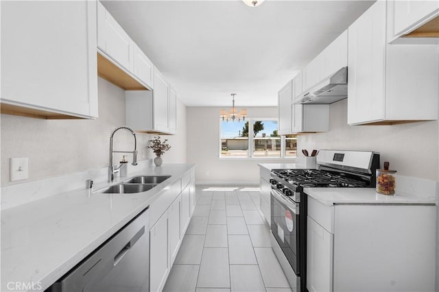 38881 Sage Tree St, Palmdale, CA 93551 - kitchen with wall chimney exhaust hood, a sink, stainless steel appliances, a chandelier, and light countertops