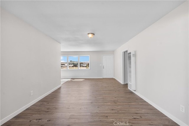 38881 Sage Tree St, Palmdale, CA 93551 - unfurnished room with a heating unit, wood finished floors, and baseboards