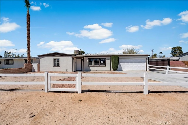 38881 Sage Tree St, Palmdale, CA 93551 - ranch-style house with an attached garage, driveway, a fenced front yard, and central air condition unit