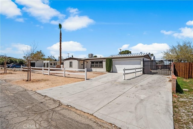 38881 Sage Tree St, Palmdale, CA 93551 - view of front facade with a fenced front yard, concrete driveway, and a garage