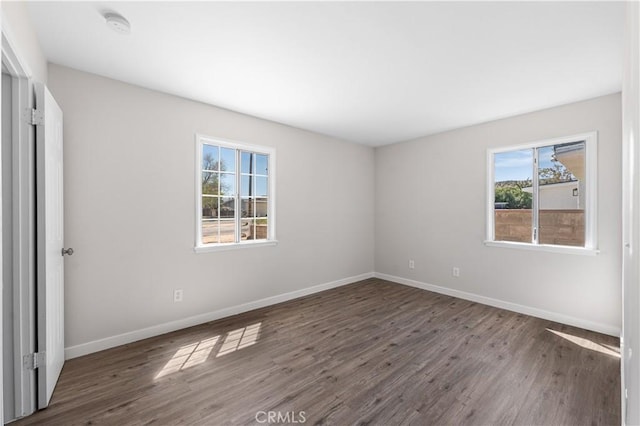 38881 Sage Tree St, Palmdale, CA 93551 - unfurnished bedroom featuring multiple windows, wood finished floors, and baseboards