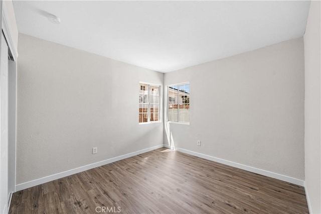 38881 Sage Tree St, Palmdale, CA 93551 - spare room featuring baseboards, wood finished floors, and a smoke detector