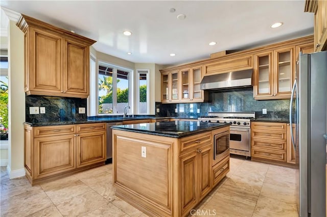 5250 Calatrana Dr, Woodland Hills, CA 91364 - kitchen featuring appliances with stainless steel finishes, range hood, decorative backsplash, a kitchen island, and recessed lighting