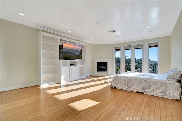 5250 Calatrana Dr, Woodland Hills, CA 91364 - bedroom featuring light wood-type flooring, recessed lighting, a glass covered fireplace, and ornamental molding