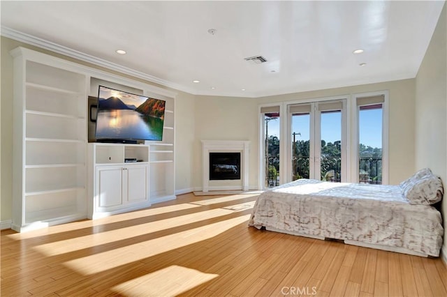 5250 Calatrana Dr, Woodland Hills, CA 91364 - bedroom featuring light wood-style floors, recessed lighting, crown molding, and a glass covered fireplace