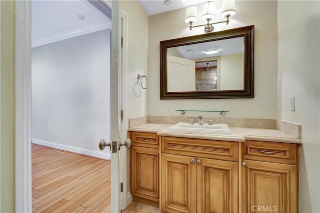 5250 Calatrana Dr, Woodland Hills, CA 91364 - bathroom featuring vanity, wood finished floors, and crown molding