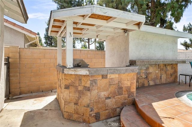 13797 Mesquite Dr, Fontana, CA 92337 - view of patio featuring exterior kitchen