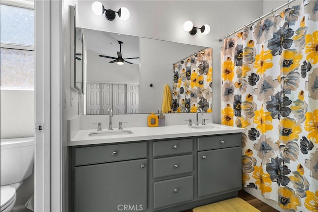 13797 Mesquite Dr, Fontana, CA 92337 - bathroom with toilet, double vanity, a ceiling fan, and a shower with curtain