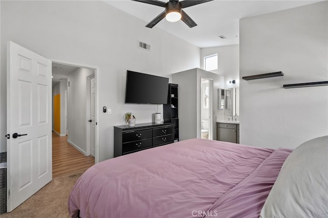 13797 Mesquite Dr, Fontana, CA 92337 - bedroom featuring high vaulted ceiling, a sink, ensuite bath, carpet floors, and a ceiling fan