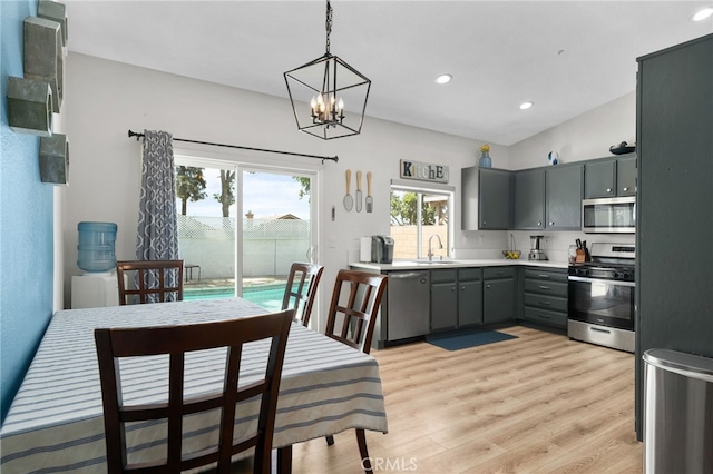13797 Mesquite Dr, Fontana, CA 92337 - kitchen with stainless steel appliances, gray cabinets, light wood-type flooring, light countertops, and a sink