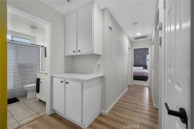 13797 Mesquite Dr, Fontana, CA 92337 - hallway featuring light wood-style flooring and baseboards