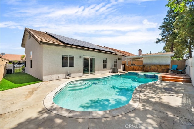 13797 Mesquite Dr, Fontana, CA 92337 - view of swimming pool with central AC unit, a fenced backyard, a patio, and a pool with connected hot tub