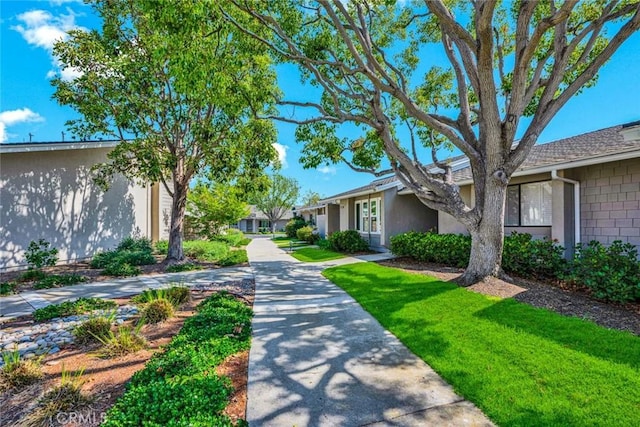 8815 Yuba Cir Unit 1102A, Huntington Beach, CA 92646 - surrounding community featuring a lawn