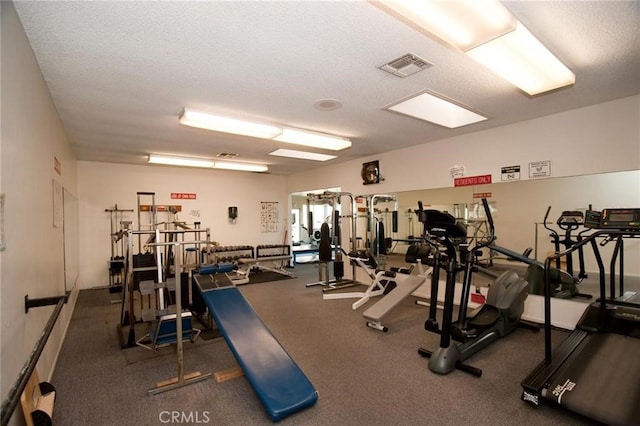 8815 Yuba Cir Unit 1102A, Huntington Beach, CA 92646 - gym featuring a textured ceiling