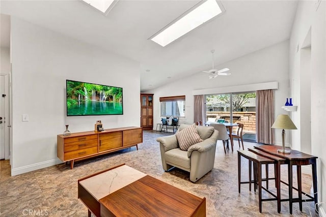 8815 Yuba Cir Unit 1102A, Huntington Beach, CA 92646 - living room with a skylight, baseboards, ceiling fan, and high vaulted ceiling