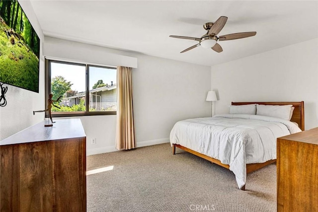 8815 Yuba Cir Unit 1102A, Huntington Beach, CA 92646 - carpeted bedroom with baseboards and ceiling fan