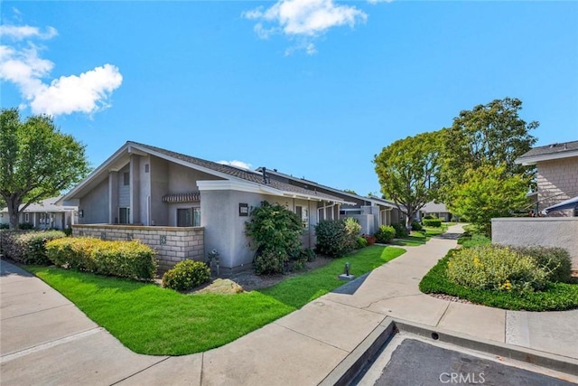8815 Yuba Cir Unit 1102A, Huntington Beach, CA 92646 - view of side of home with stucco siding