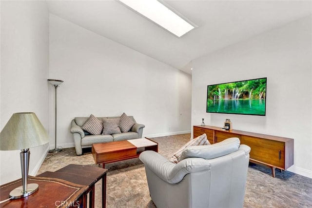 8815 Yuba Cir Unit 1102A, Huntington Beach, CA 92646 - living area with baseboards and lofted ceiling