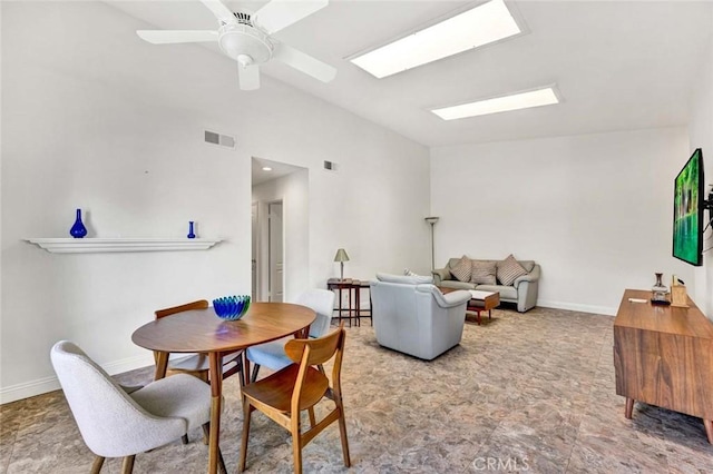 8815 Yuba Cir Unit 1102A, Huntington Beach, CA 92646 - dining room featuring vaulted ceiling, a skylight, baseboards, and a ceiling fan