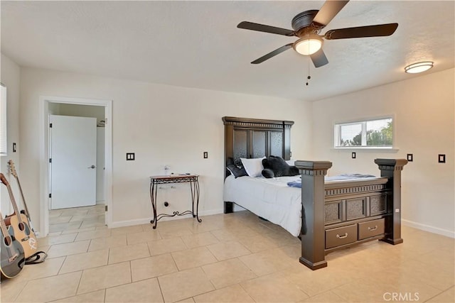 828 Tehama Ave, Oroville, CA 95965 - bedroom featuring baseboards, a ceiling fan, and light tile patterned flooring