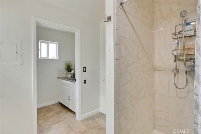 828 Tehama Ave, Oroville, CA 95965 - full bathroom featuring a tile shower, baseboards, and electric panel