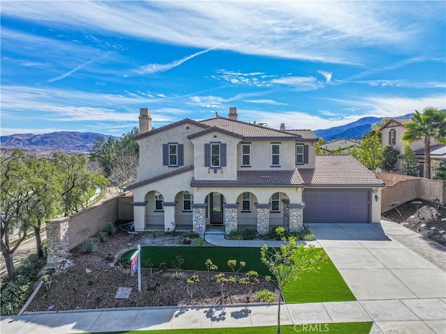 8365 Sanctuary Dr, Corona, CA 92883 - mediterranean / spanish-style house featuring stucco siding, a chimney, driveway, a tile roof, and a mountain view