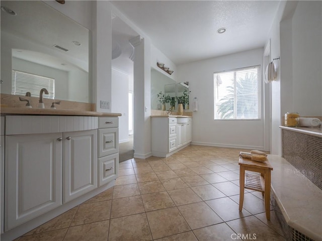 8365 Sanctuary Dr, Corona, CA 92883 - bathroom with two vanities, tile patterned flooring, and baseboards