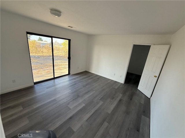 3874 Kreuer Rd, Phelan, CA 92371 - spare room with dark wood-style floors and baseboards