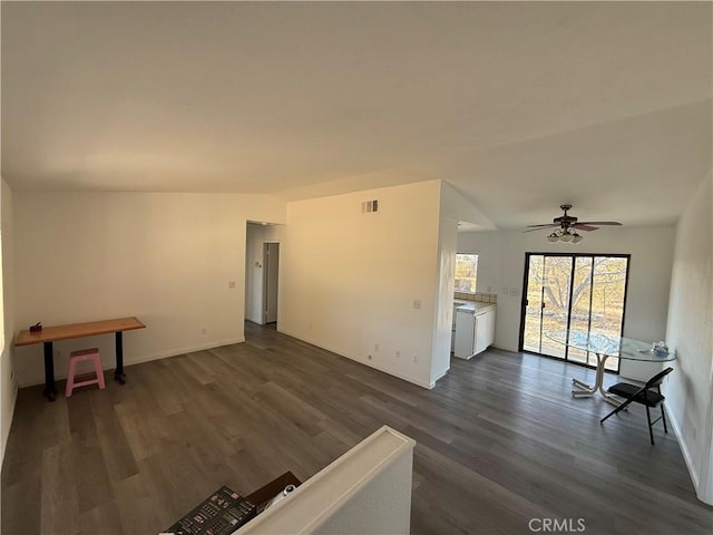 3874 Kreuer Rd, Phelan, CA 92371 - unfurnished living room featuring dark wood finished floors, a ceiling fan, and baseboards
