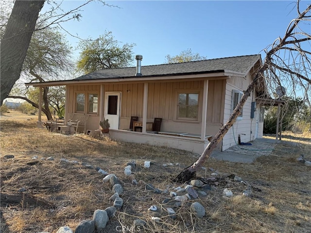 3874 Kreuer Rd, Phelan, CA 92371 - back of house featuring board and batten siding and a shingled roof