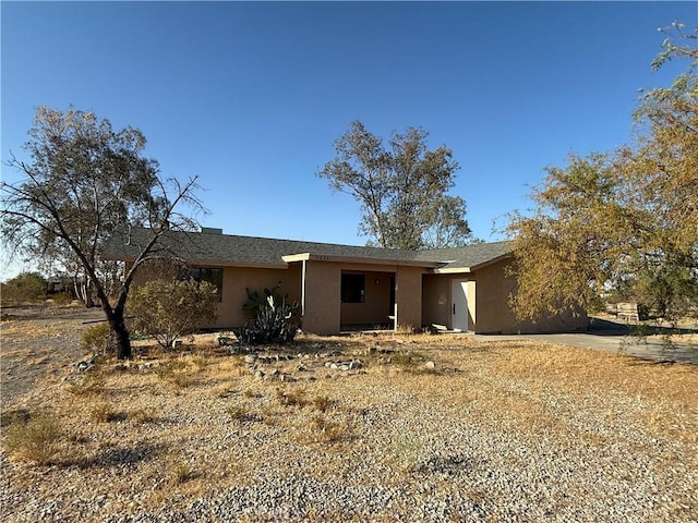 3874 Kreuer Rd, Phelan, CA 92371 - view of front facade featuring stucco siding and driveway