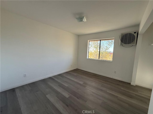 3874 Kreuer Rd, Phelan, CA 92371 - empty room with dark wood-style floors and baseboards