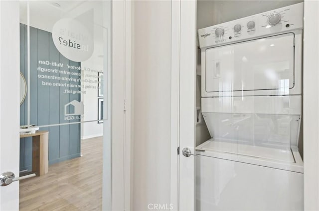 41847 Oak Barrel Ct, Palmdale, CA 93551 - washroom featuring estacked washer and dryer and wood finished floors