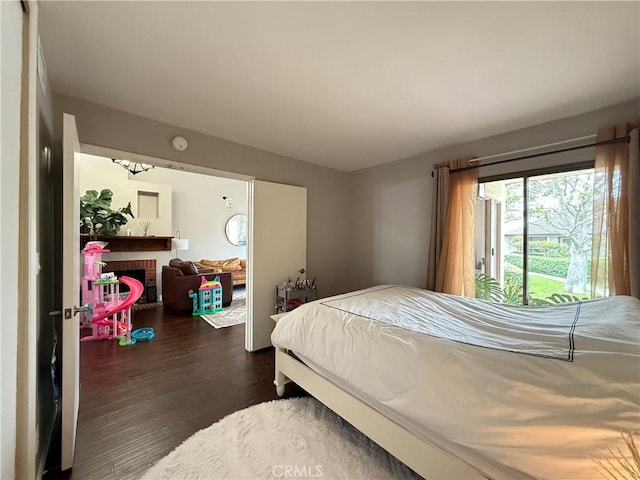 6310 Ridgemar Ct, Rancho Palos Verdes, CA 90275 - bedroom featuring dark wood-type flooring and a brick fireplace