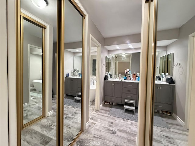 6310 Ridgemar Ct, Rancho Palos Verdes, CA 90275 - bathroom featuring vanity, wood finished floors, and baseboards