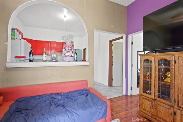 213 N Figueroa St, Santa Ana, CA 92703 - bedroom featuring freestanding refrigerator and arched walkways