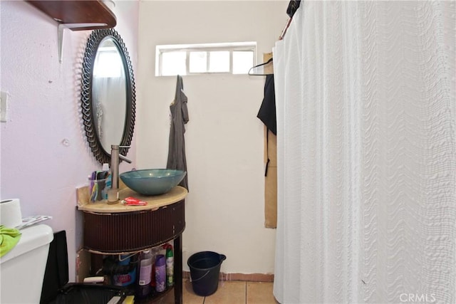 213 N Figueroa St, Santa Ana, CA 92703 - bathroom with toilet, tile patterned flooring, vanity, and a shower with shower curtain